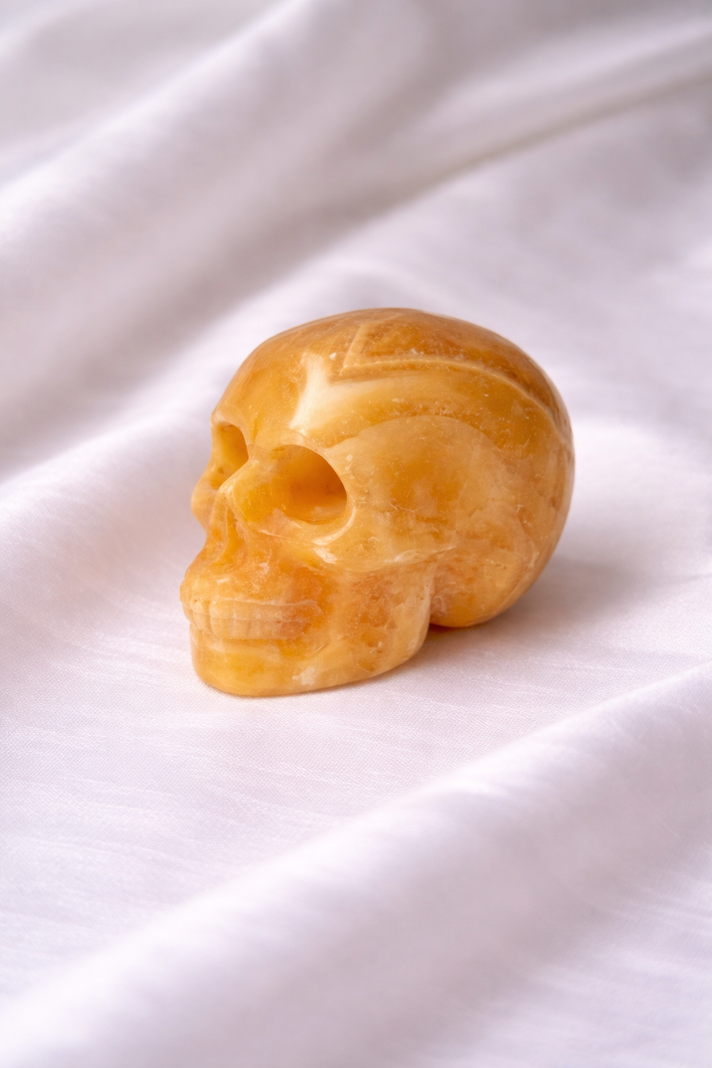 Orange calcite skull